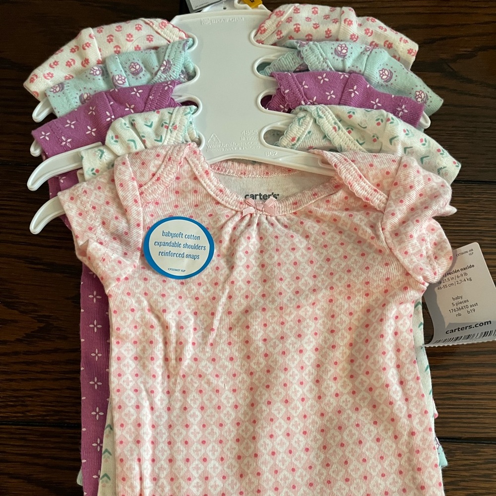 Carter’s newborn onesie set. New with tags